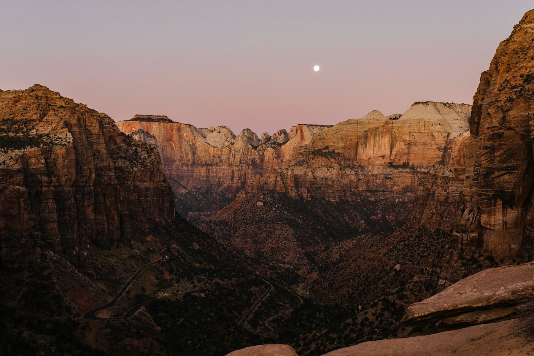 Red canyon walls in the glow of sunrise