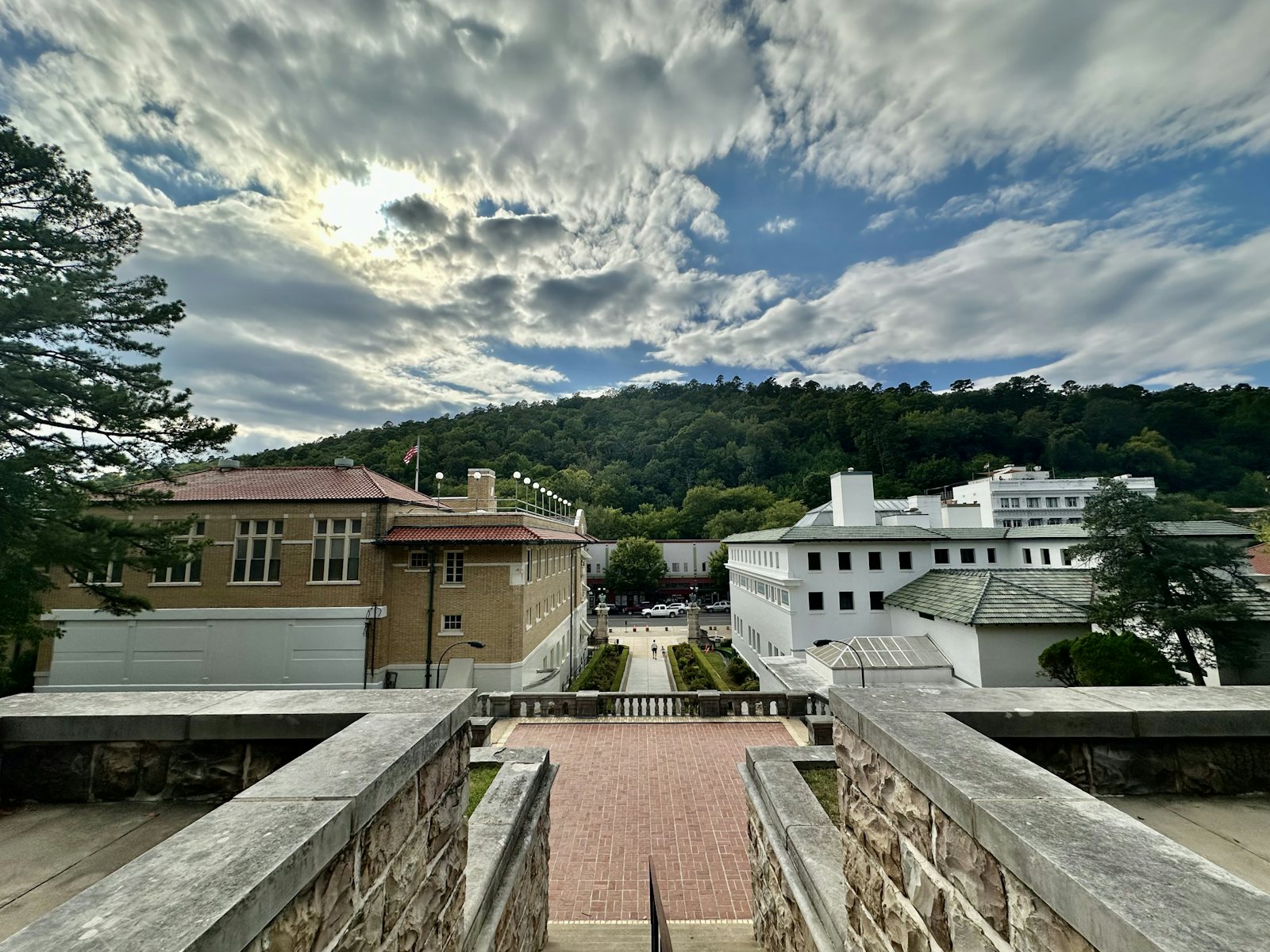 The Grand Promenade overlooks the historic bathhouses of Bathhouse Row beneath dramatic clouds in Hot Springs National Park, Arkansas